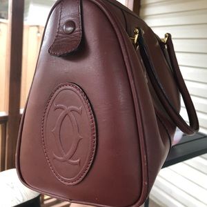 Burgundy pre-loved Cartier bag